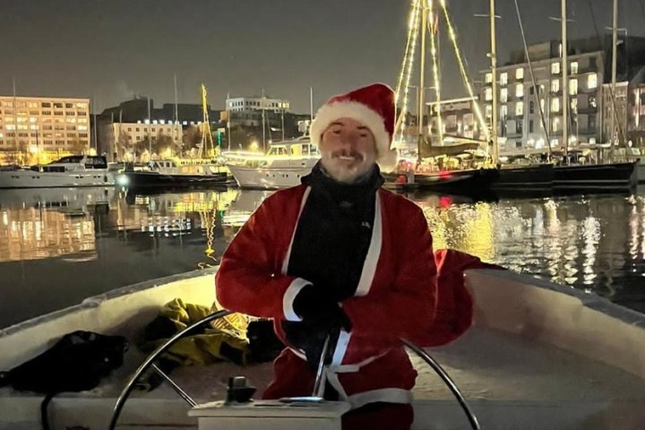 a person sitting on a boat in the water