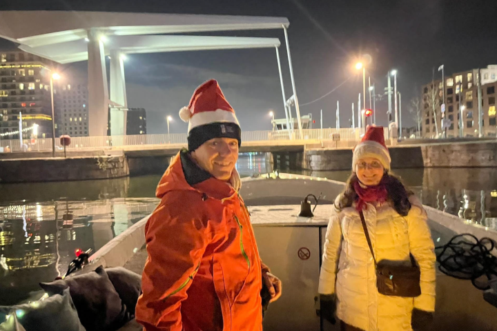 a man and a woman standing in front of a building