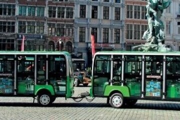 a double decker bus parked in front of a building