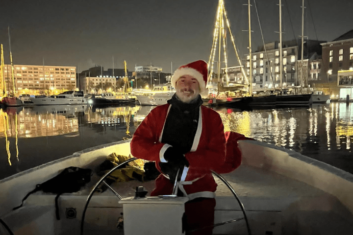 a man standing in front of a boat