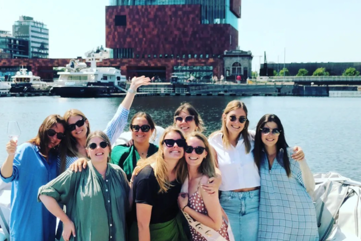 a group of people standing in front of a building