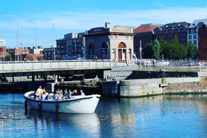 a small boat in a harbor next to a body of water