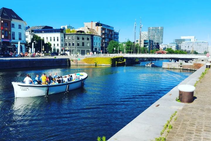 a boat is docked next to a body of water