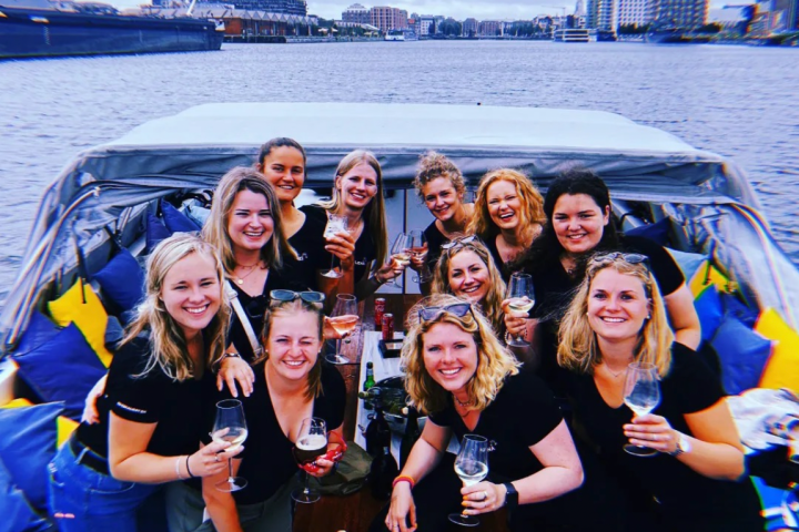 a group of people on a boat posing for the camera